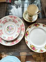 Group shot of all six pieces including plates, bowl, cup and saucer