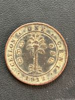 Reverse of 1912 Ceylon one cent coin showing palm tree design and inscriptions