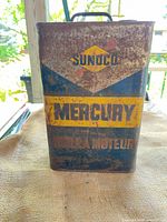 Front view showing Sunoco Mercury branding and rust