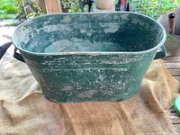 overall view of green galvanized steel oval tub