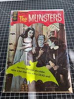 Front cover of Gold Key The Munsters comic book showing title, actors, price and condition