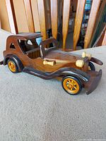 full view wooden vintage car model driver side
