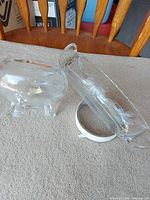 Footed candy dish and oval pickle dish side by side