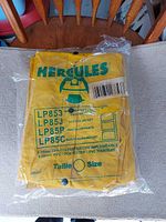 Front of packaged Hercules yellow rain suit