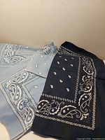 Navy and light blue paisley bandanas stacked