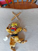 Full view of marionette, strings, controller bar