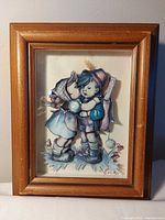 Full view of framed 3-D Hummel-style artwork