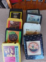 Group of eight 8-track tapes arranged in two columns