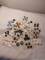 Spread of all button cards on table