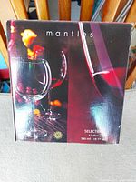 Front of Mantles Selection box showing wine glasses