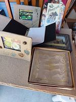 Group of five assorted photo albums on tabletop