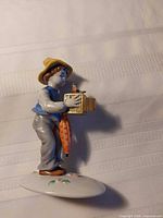 Front view of porcelain boy figurine