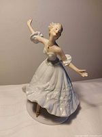 Front view of Wallendorf porcelain dancing figurine showing dress detail and pose