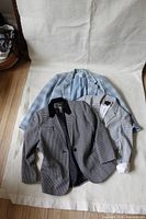 All three blazers laid out together
