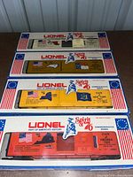Four boxed Lionel Spirit of '76 state boxcars