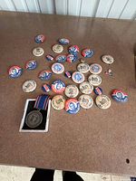 Overview of buttons and medal box on table