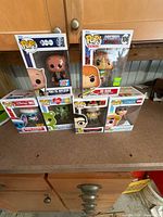 Front view of all six boxed Funko Pop figures
