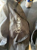 Black Kshioe zippered carry bag