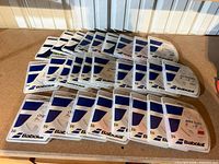 All 27 Babolat string reels laid out edge-to-edge