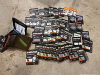 Wide shot of all HEAD string packs, overgrips, tape reels and pouch