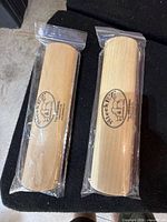 Front view of two sealed SleekEZ grooming tools