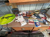 Overview of all tennis accessories on workbench