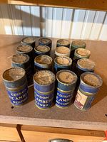 16 Edison Blue Amberol storage tubes showing labels and lid wear