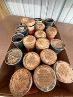 Box of Edison cylinder records in tubes, lids visible