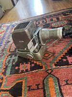Left side view of Aldis slide projector showing body, base and slide carrier