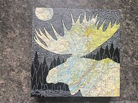 Front view of square Alan Dhingra moose map print on board