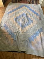 Full view of front showing log cabin pattern and color palette