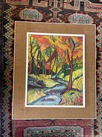 Framed painting on burlap mat showing overall piece
