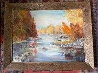 Front view of framed oil landscape painting