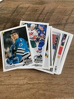 Stack of Upper Deck hockey rookie cards, top card Pat Falloon Star Rookie