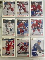 Nine sample Canada Cup cards in binder sleeve