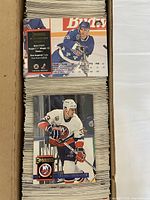 Open cardboard box filled with stacked Donruss NHL hockey cards