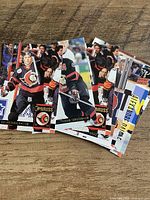 Fanned layout of seven Ottawa Senators hockey cards showing player fronts and backs