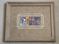 Front view of framed Indigenous print showing artwork, mat and frame
