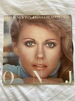 Front cover of Olivia Newton-John Greatest Hits vinyl LP