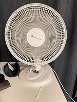 Front view of Comfort Zone tabletop fan showing grille and controls