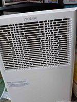 Front grill and branding of NOMA white appliance
