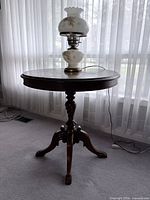 Full view of round pedestal table showing overall design and finish