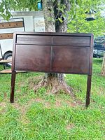 Front view of dark walnut panel headboard