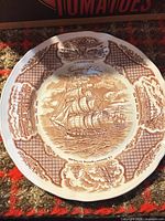 Front of Alfred Meakin brown transferware dinner plate