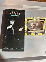 Front view of both items: RCA 5-CD box set and Vandor desk clock