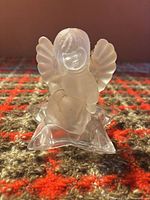 Front view of frosted angel on clear star base