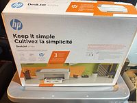 Front of retail box showing HP DeskJet 2755e model and features