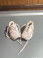 Pair of light pink toddler New Balance sneakers top view