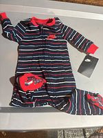 Full view of Nike striped footed coverall with hang tag