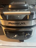 Front view showing brand logo and control panel of PowerXL unit